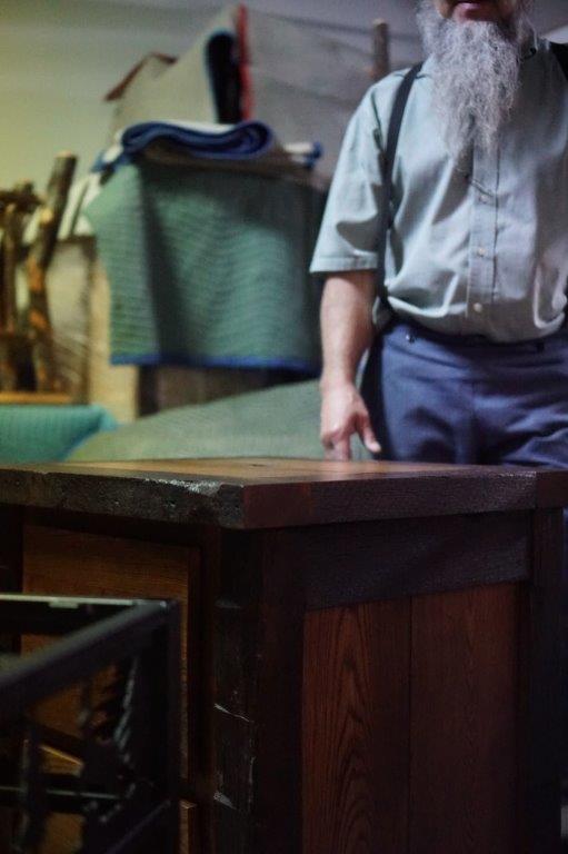 Woodworker with a piece with a hickory side table. 