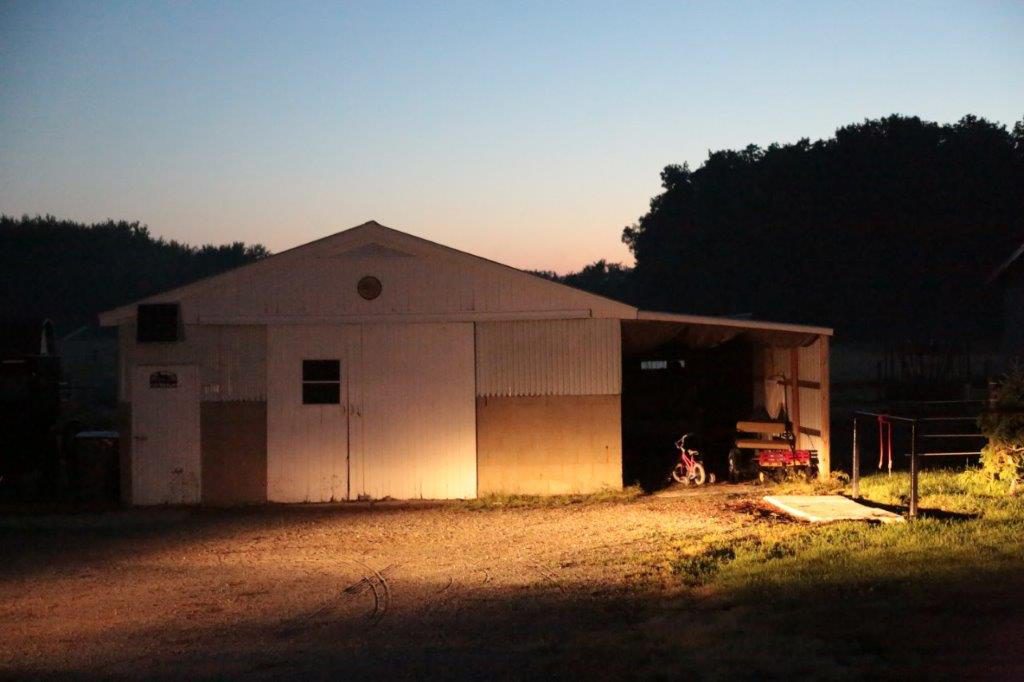 The sun has barely begun to rise outside of a woodshop in Indiana