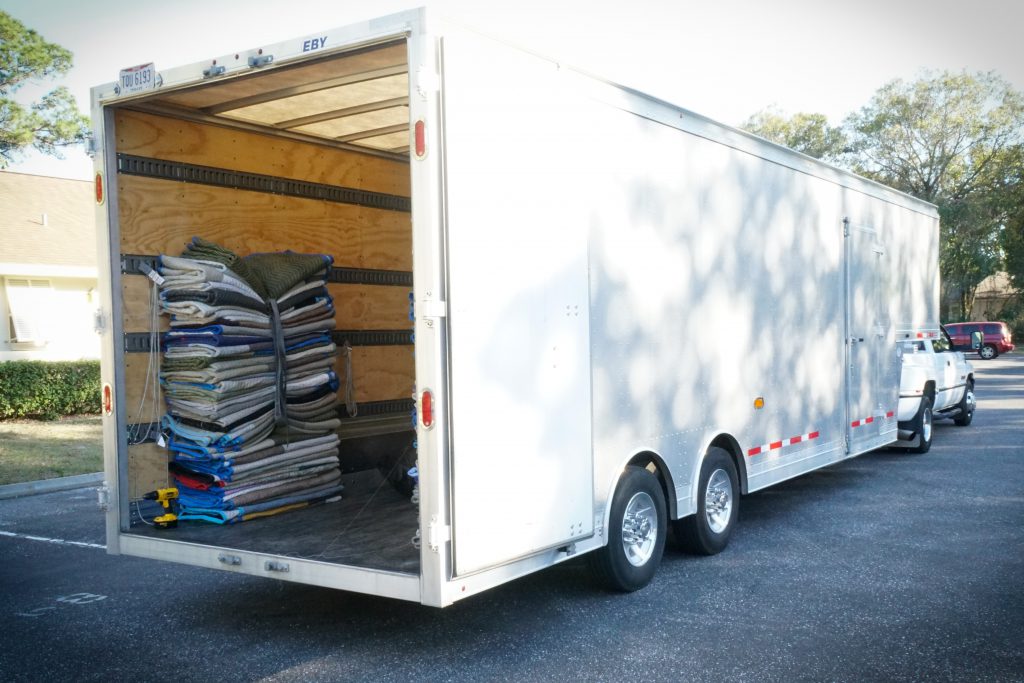 Padded moving blankets in the back of a truck