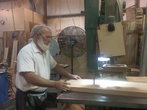 Each piece of wood is fed through machine by hand.