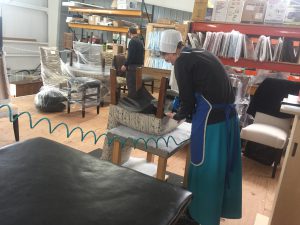 Working on upholstery at Genuine Oak Wooshop Ohio. 