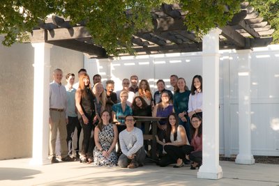 The DutchCrafters Team under a pergola at the DutchCrafters Store.