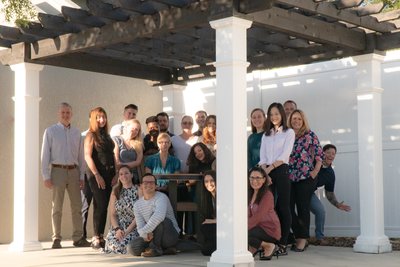 DutchCrafters Team under a pergola at the DutchCrafters store.