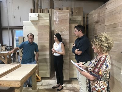 DutchCrafters employees visiting an Amish wood shop.