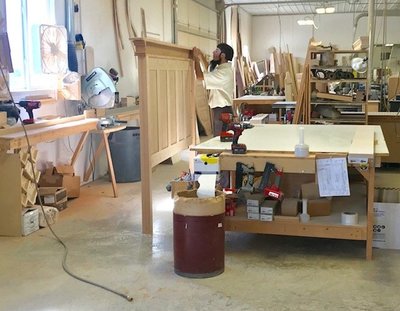 A woodworker in an Amish woodshop.