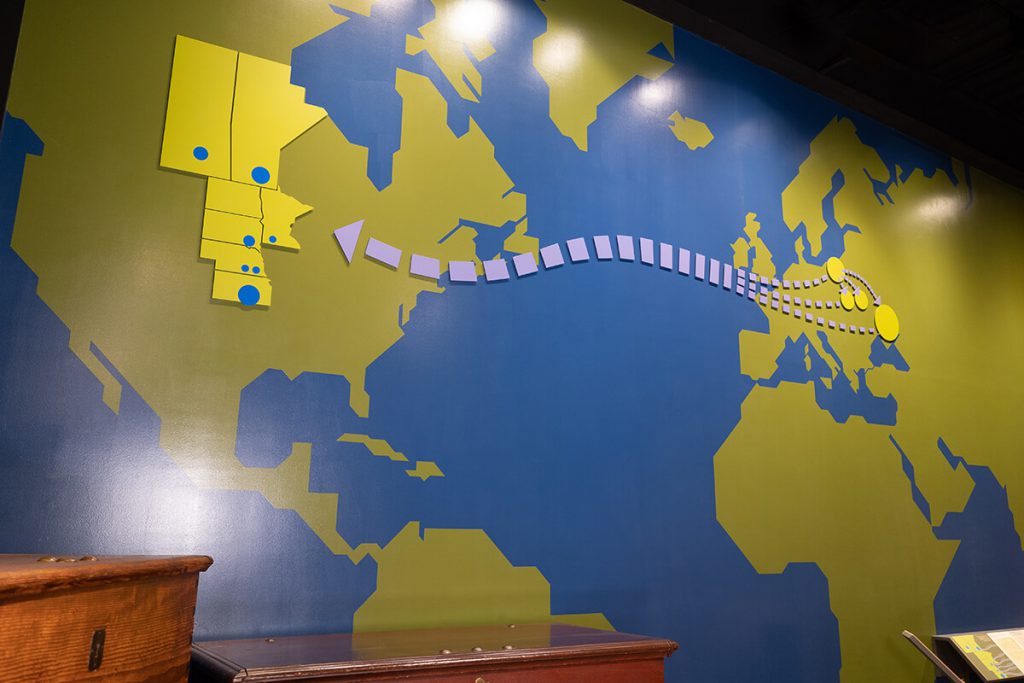 A map visualizing the Russian Mennonite migration from Europe to the plains of America, displayed at Kauffman Museum, North Newton, KS