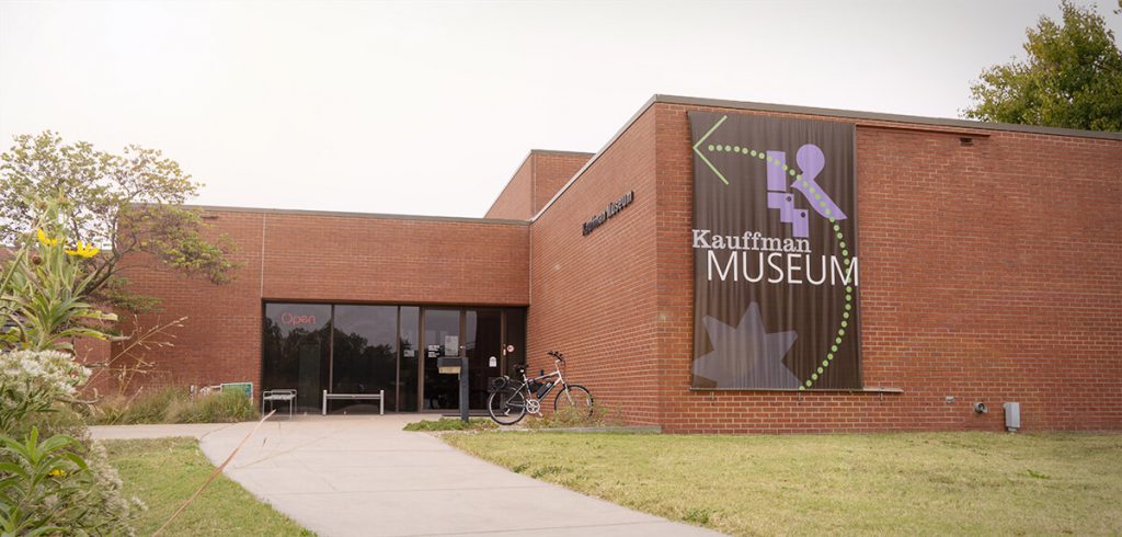 The front of a wide brick building housing Kauffman Museum