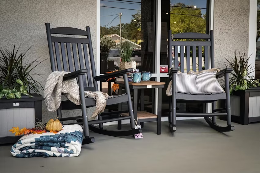 Two Berlin Gardens poly porch rocking chairs.