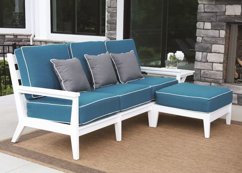 Berlin Gardens Mayhew Patio Sofa with white frame and blue cushions