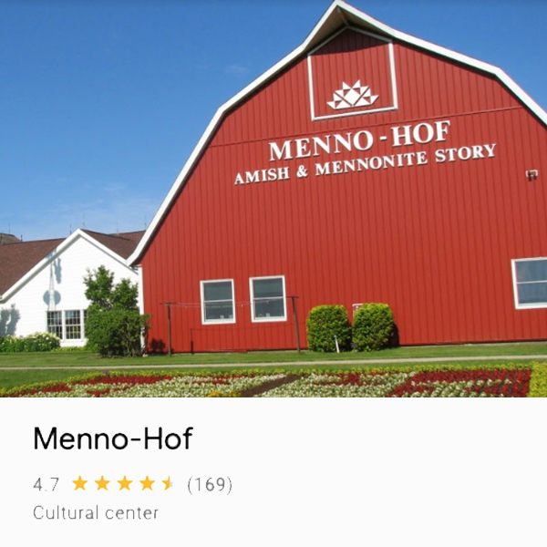 Photo of barn-looking building that houses the Menno-Hof, and Amish and Mennonite Information Center