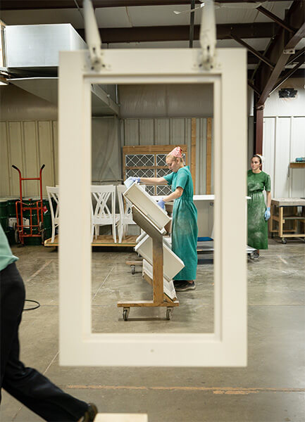 Amish women working in a wood finishing shop