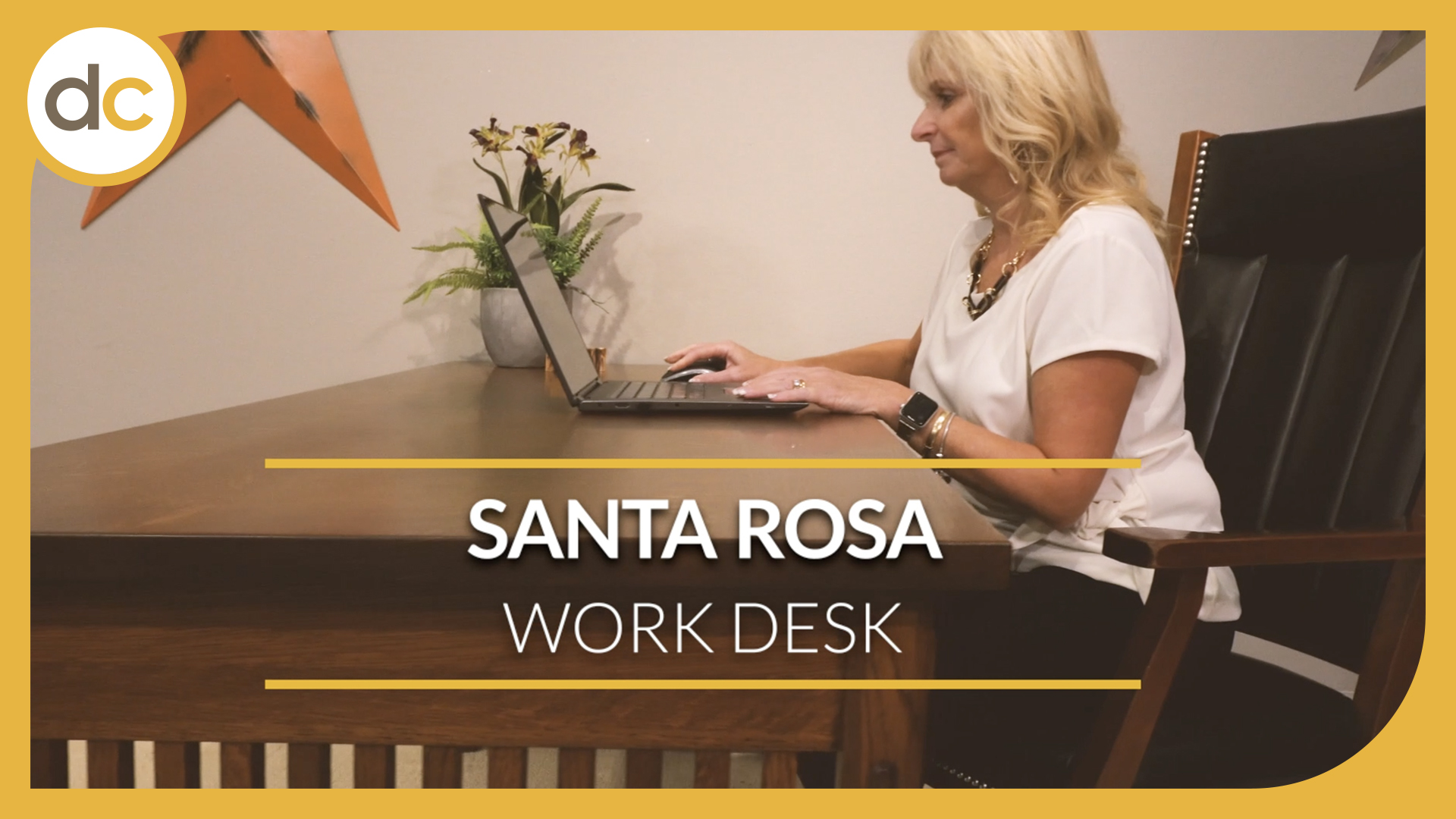 The title Santa Rosa Work Desk is displayed over a woman sitting at a mission style desk