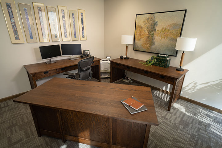 wide shot of an office with 3 Amish Craftsman style desks