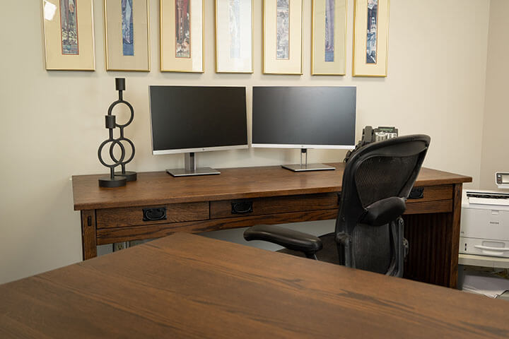 Amish Signature Mission Work Desk topped with computer monitors